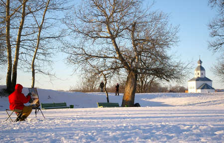 artrist painting a chapel from life in winter in Suzdal, Russiaの写真素材