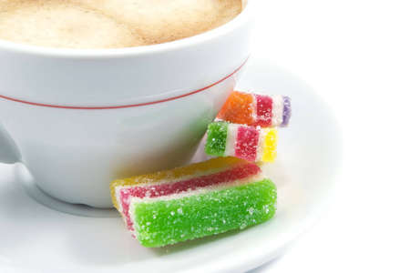 cup of coffee with three pieces of marmaladeの写真素材