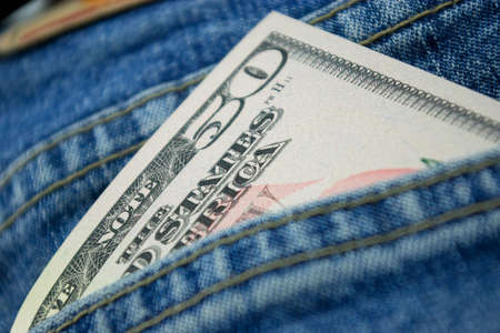 dollars in jeans back pocketの写真素材