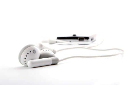 portable grey headphones with player on white backgroundの写真素材