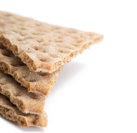 stack of several pieces of crisp cereal bread isolated on whiteの写真素材