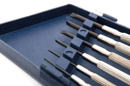 set of precision screwdrivers in plastic case on white background