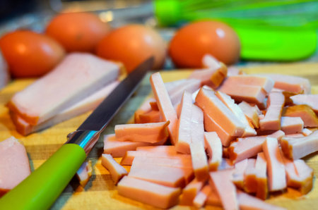 Still life with knife, eggs and meatの写真素材