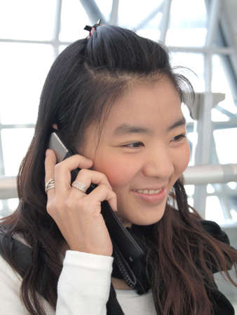 Young asian woman , businesswoman talking on mobile phone    