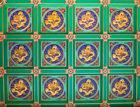 Golden dragons sculpture Wallpaper at chinese temple in Thailand 