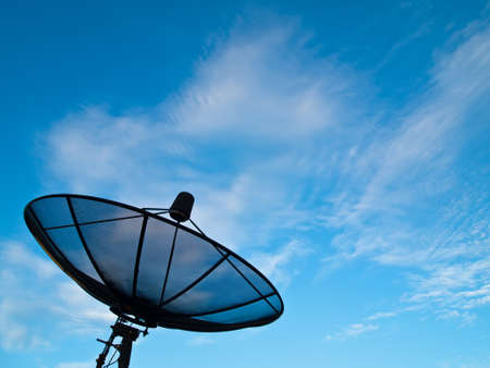 Satellite dish with blue sky and cloud backgroundの写真素材
