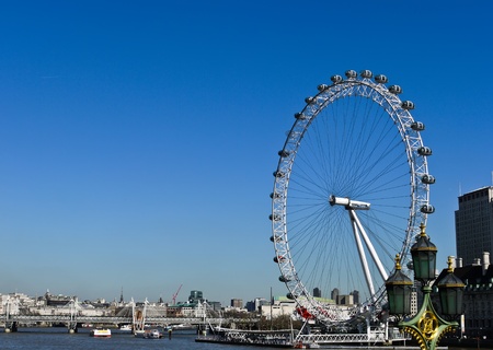 The London Eye and River Thames with blue sky on the background in London , UKのeditorial素材