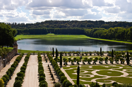 Decorative gardens with orange trees at Versailles Castle in France  の写真素材