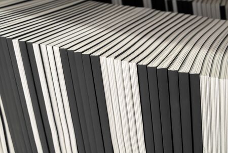 Closeup Stack of books,magazine on shelf with space for text. Time to learn and read concept. Selective soft 
focus image. の写真素材