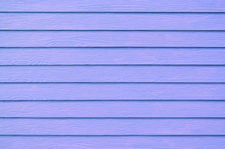 Wall panel paint purple,blue color synthetic wooden plank texture surface background. Outdoor panel wood nature pattern or abstract backdrop vintage  horizontal lines ,summer design and decoration.の写真素材