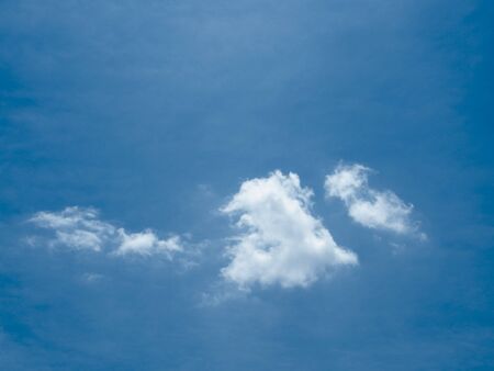small clouds moved slowly by the wind. The beautiful sky with white clouds.