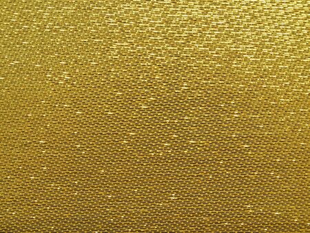 Gold thread on the fabric.の写真素材