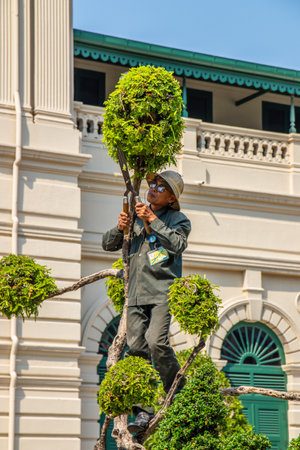 Bangkok Thailand Southeast Asia The gardener at work in the Royal Grand Palaceのeditorial素材