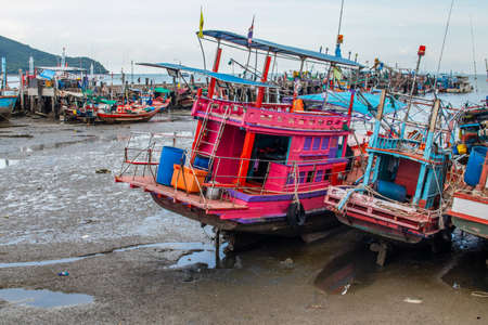 fishing boats at a pier in Thailand Southeast Asiaの写真素材