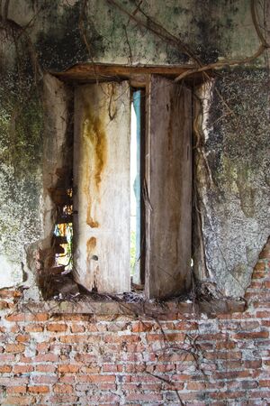 this picture transfers in older church in Cholburi inside have doctrines that hangs to keep follow the partition wall transfers in the morning transfer to turn back the light that goes under to come in door way , at a window has wood root puts in to come の写真素材