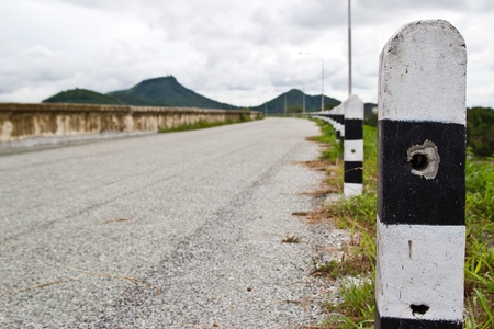 the road where a reservoir at chonburi thailandの写真素材