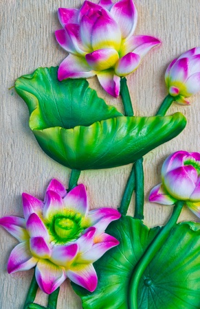 clay doll sit near waterfall at thailand.の写真素材