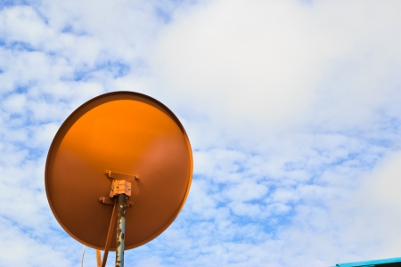 red dish antennas with blue skyの写真素材