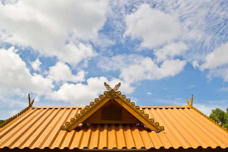 thai house roof an nice blue skyの写真素材