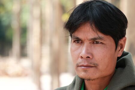 young face ordinary man standsの写真素材