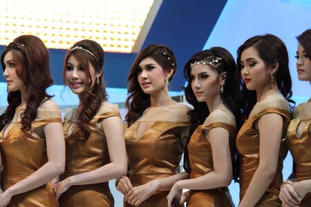 BANGKOK, THAILAND - APRIL 6: Unidentified female presenter with car at  booth in The 33rd Bangkok International Motor Show 2013 on april 6, 2013 in Bangkok, Thailand.のeditorial素材