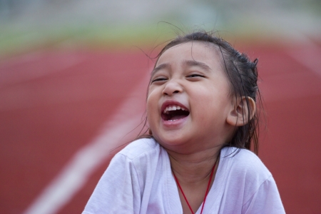 Cheerful girl in sports stadiumの写真素材