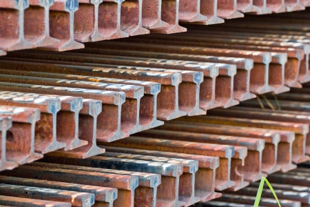 row of corroded steel train rail beamsの写真素材