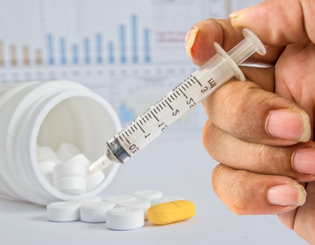 syringe and tablets