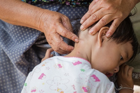 girl holds her mother by hand