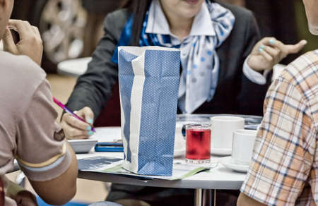 Businesspeople Having Meeting Around Table In Modern Officeの写真素材
