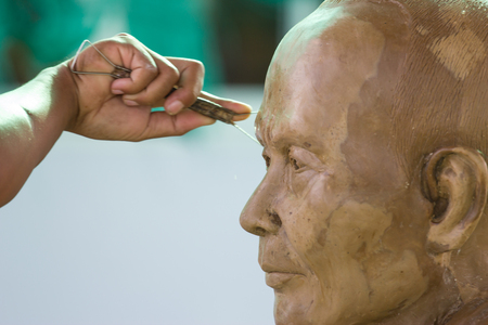 Sculpture Tool  artisan creates the head of a Buddhist monkfestival in thailandの写真素材