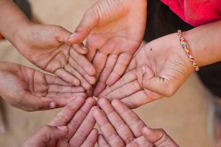 Family holding hands together closeupの写真素材