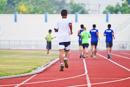 Cropped image of  runner on competitive runningの写真素材