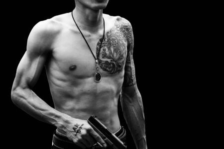 Handsome young man with tattooの写真素材