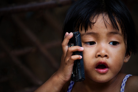 asian girl who talks on the telephoneの写真素材