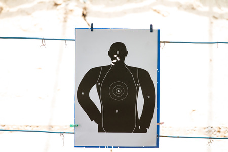 Target practicing with gun In the shooting range