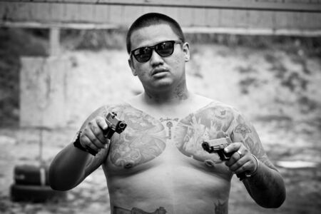 Handsome young man with tattooの写真素材