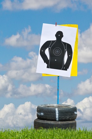 hand with gun shooting targetの写真素材