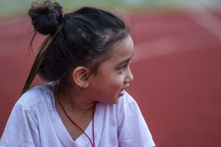 Cheerful girl in sports stadiumの写真素材