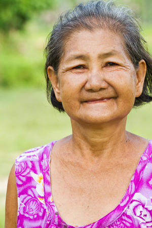 Portrait of  smiling elderly womanの写真素材