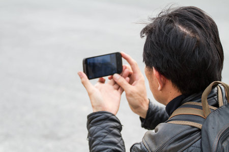 mobile phone camera in male hands

