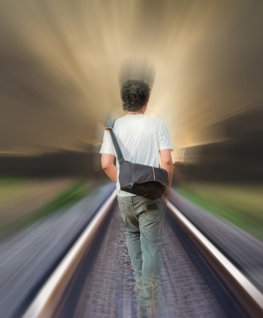  man walking on the railway tracksの写真素材