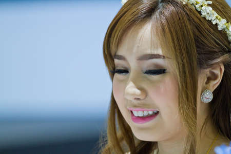 BANGKOK - AUGUST 17 : Unidentified pretty girls display on KAWASAKI at The 35th Bangkok International Motor Show 2014 on AUGUST 17, 2014 in Bangkok, Thailand.のeditorial素材