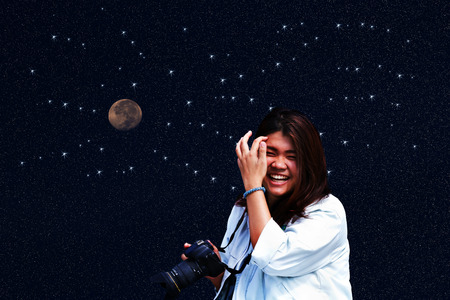 attractive young woman talking pictures outdoorsの写真素材