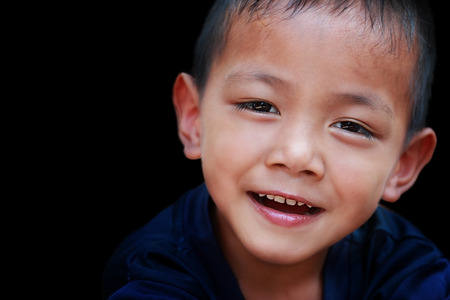 portrait of a little boy with light and shadow treatmentの写真素材