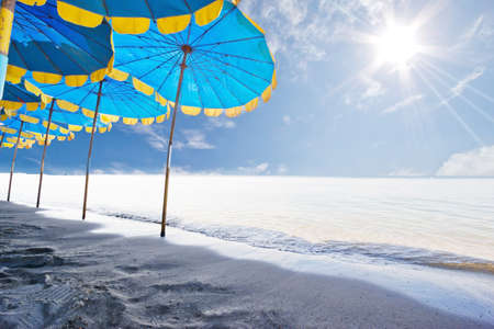 The beach and the beach umbrella of midsummer.の写真素材