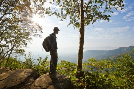 Man's silhouette at a viewpoint overlooking central Thailandの写真素材