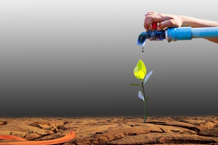 water pipe on dry earth texture at thailandの写真素材