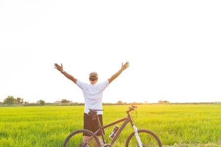 Cyclists take yourself selfie rice fieldsの写真素材