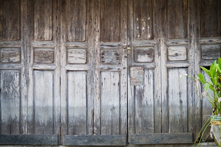 old wooden door with a metal lock. Background textureの写真素材
